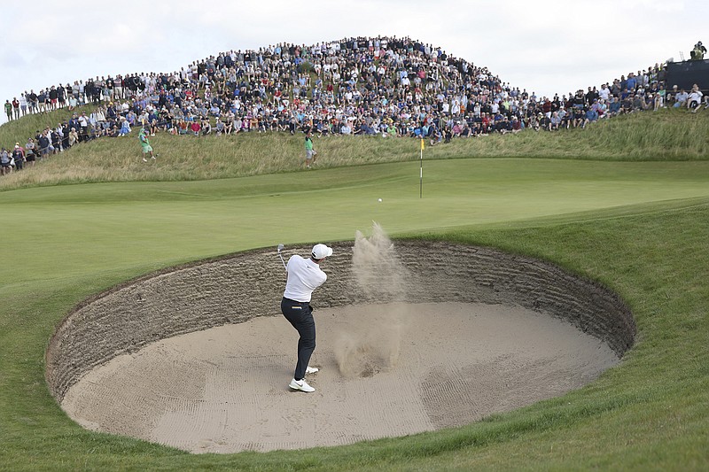 AP photo by Peter Morrison / Rory McIlroy plays out of a bunker near the sixth green at Royal St. George's Golf Club during the first round British Open on Thursday in Sandwich, England.