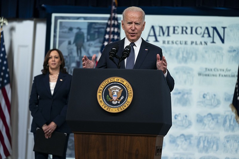 Vice President Kamala Harris listens as President Joe Biden speaks during an event to mark the start of monthly Child Tax Credit relief payments, in the South Court Auditorium on the White House complex, Thursday, July 15, 2021, in Washington. (AP Photo/Evan Vucci)