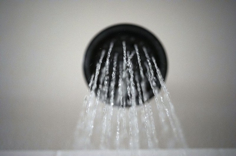 FILE - In this Aug. 12, 2020 file photo, water flows from a showerhead in Portland, Ore. (AP Photo/Jenny Kane)


