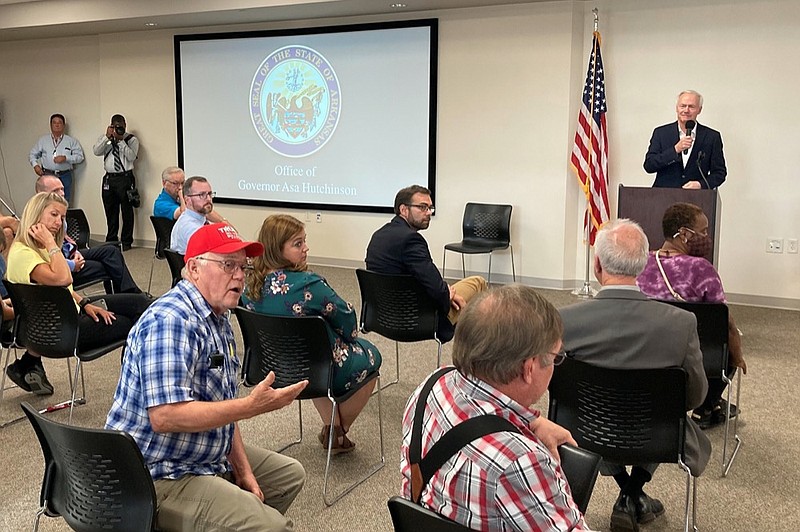 Robert Hogan speaks at the Batesville Community Center in Batesville, Ark., on Monday, July 12, 2021 as Arkansas Gov. Asa Hutchinson looks on. (AP Photo/Andrew DeMillo)


