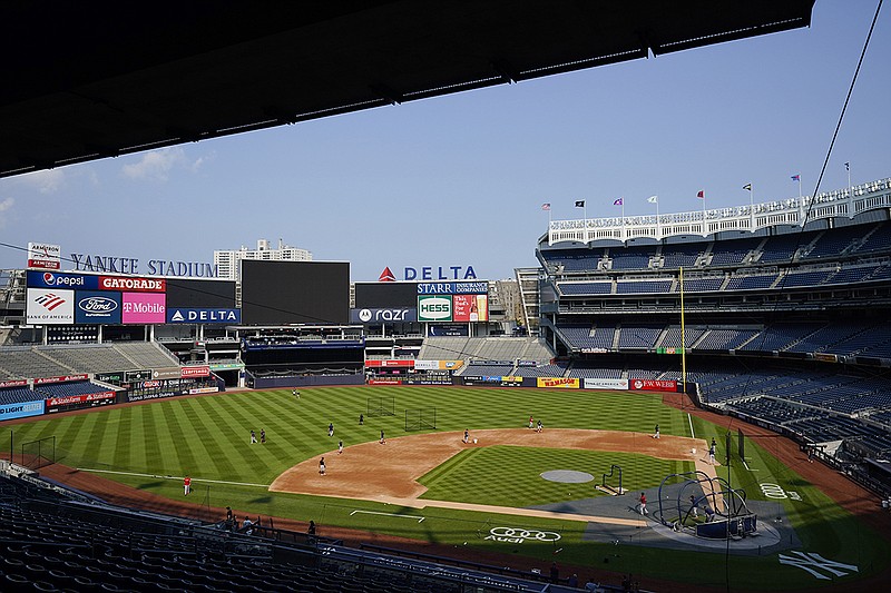 AP photo by Frank Franklin II / The Boston Red Sox take batting practice Thursday at Yankee Stadium in New York. They were scheduled to face Yankees that night in Major League Baseball's return from the All-Star break, but the game was postponed after multiple New York players tested positive for COVID-19.