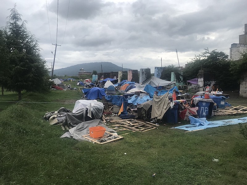 Photo by Dave Flessner / Tents set up along the railroad tracks off of 11th Street in downtown Chattanooga on Monday. July 19, 2021, show the continued homeless population in the city despite the extra relief provided during the pandemic. Housing experts say a lack of affordable housing in Chattanooga is keeping homelessness higher.