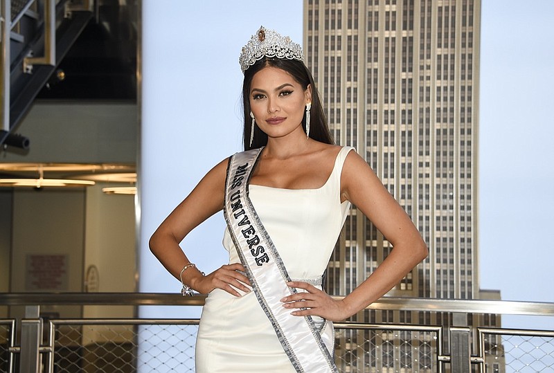 FILE - Newly crowned Miss Universe, Andrea Meza of Mexico, poses for the media during her visit to the Empire State Building on May 18, 2021, in New York. The next Miss Universe competition will take place in December in Eilat, Israel. The Miss Universe Organization also announced Tuesday, July 20, 2021, that the contest will again broadcast live in the U.S. on Fox with Steve Harvey returning to host. This will be the 70th Miss Universe competition and will end with Meza crowning her successor. (Photo by Evan Agostini/Invision/AP, File)