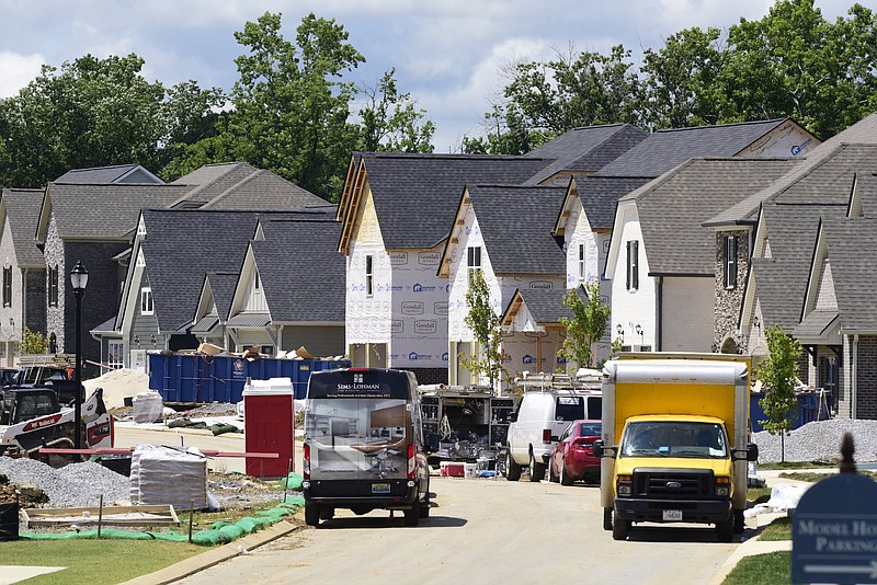 Staff Photo by Robin Rudd / Contractors busily complete homes in Westview Crossing off East Brainerd Road earlier this month. More than 300 East Brainerd residents, many fed up with clogged roads and worries about over-development with more homebuilding on the way, met with key city, county and state officials earlier this summer.