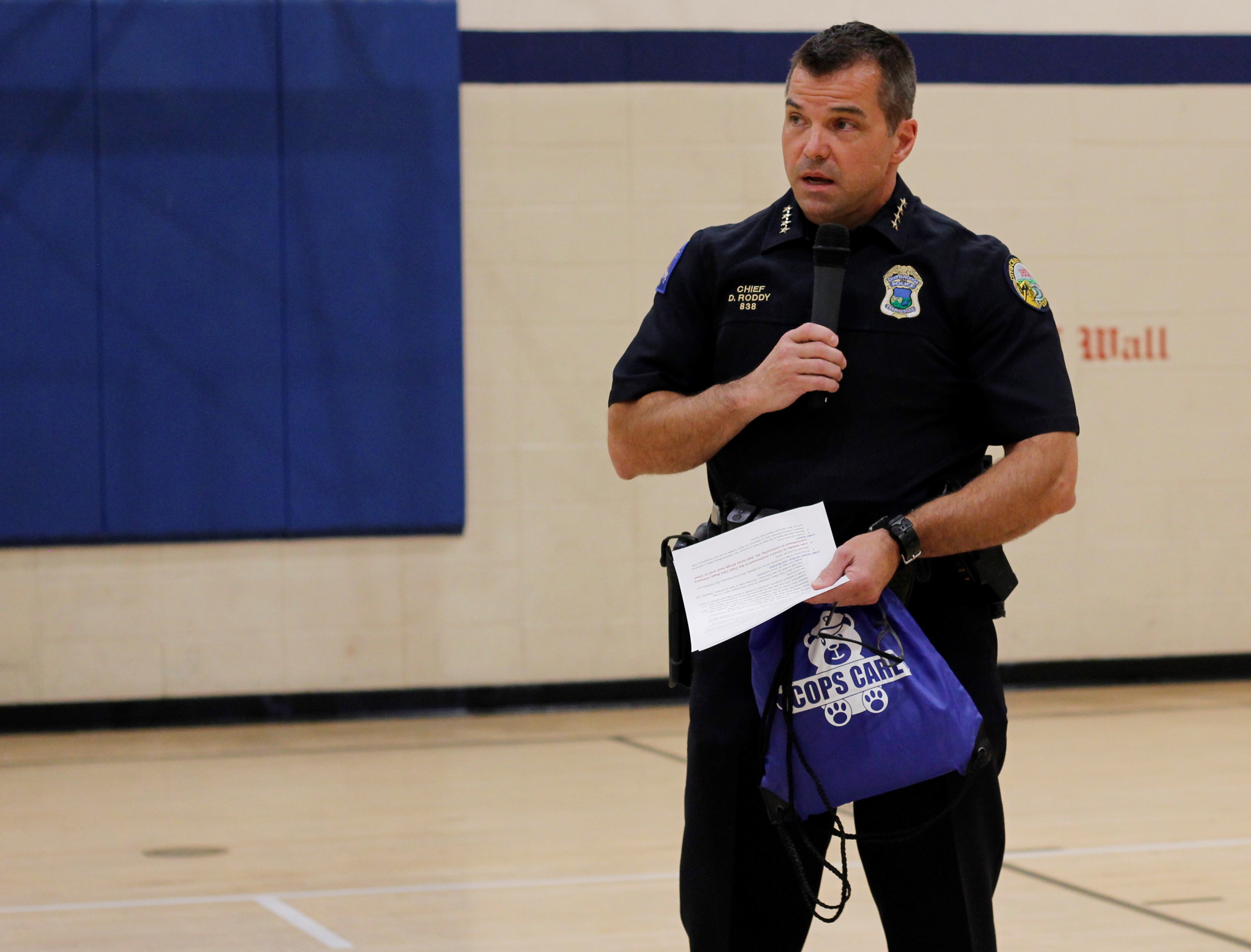 Staff Photo by Tierra Hayes / Chattanooga Police Chief David Roddy explains the new "Cops Care" care package program to officers on Wednesday, July 21, 2021. The collaboration between Unum and the Chattanooga Police Department will provide bags for children at police scenes in an attempt to bring comfort and a distraction. The kits include items such as a blanket, a stress ball, stuffed animals and coloring books.