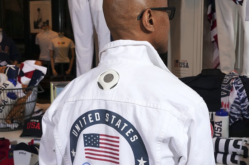 FILE - Former Olympic medalist in fencing Peter Westbrook models the Team USA Tokyo Olympic opening ceremony flag bearer uniform that features cooling technology at the Ralph Lauren SoHo store on July 7, 2021, in New York. Olympic gear makes for lively social media fodder, starting with the hours-long Parade of Nations. The year's wait due to the pandemic has given enthusiasts extra time to ponder what they love or hate. (Photo by Charles Sykes/Invision/AP, File)