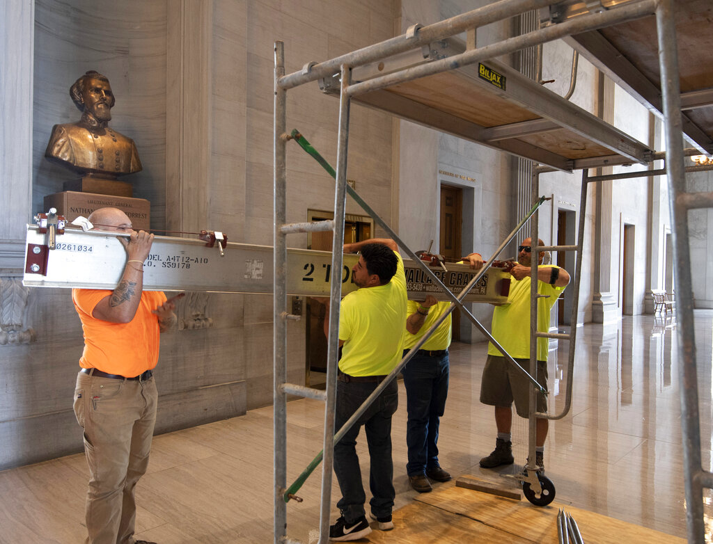 Workers prepare scaffolding in front of a bust of Confederate general and early Ku Klux Klan leader Nathan Bedford Forrest at the State Capitol Thursday, July 22, 2021, in Nashville, Tenn. A decadeslong effort to remove the bust from the Tennessee Capitol cleared its final hurdle Thursday, with state leaders approving the final vote needed to allow the statue to be relocated to a museum. (George Walker IV/The Tennessean via AP)