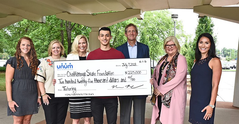 Contributed photo / Chattanooga State and Unum representatives gather to display a $225,000 check in support of tutoring at the college. From left: Rachel Hargis, corporate social responsibility, and Wendy Gibson, senior vice president, corporate services, Unum; Dr. Rebecca Ashford, president, Chattanooga State; Mark Monterosso, student, Chattanooga State; Tom White, senior vice president, investor relations, Unum; Dr. Beth Norton, vice president, academic affairs, Chattanooga State; and Jeana Lee, program manager, corporate social responsibility, Unum.