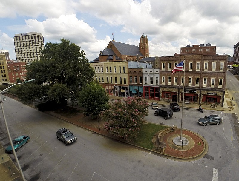 Staff File Photo/ Patten Parkway is shown as it looked prior to its transformation into Patten Square. Visible at near right is the American Legion flagpole. The center area also contained monuments to area World War II dead and to area Marine casualties.