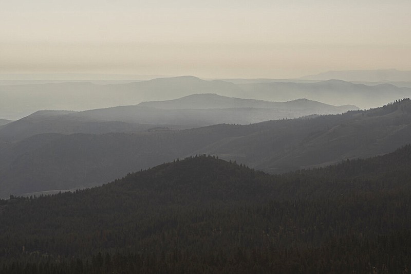 Smoke from the Bootleg Fire lingers on Thursday, July 22, 2021, near Paisley, Ore. (AP Photo/Nathan Howard)