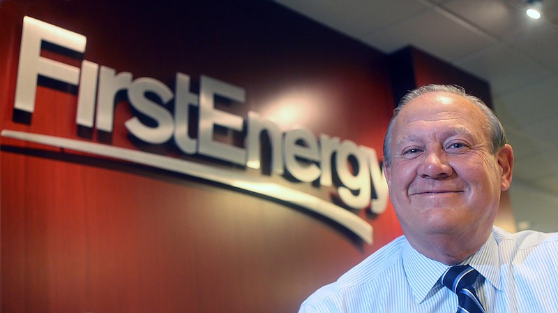 In this 2015 file photo, FirstEnergy Corp. then-President and CEO Charles "Chuck" Jones appears at the company's Akron, Ohio headquarters. Six top executives from the company have been fired, including Jones, since the alleged $60 million bribery case, involving ex-Ohio House Speaker Larry Householder and others. Federal authorities say the Akron-based FirstEnergy Corp. has agreed to a settlement that calls for the company to fully cooperate and pay a $230 million fine as part of a sweeping bribery scheme. The dismissal of Jones, who initially denied any wrongdoing by the company, appeared to be tied to a $4.3 million payment that FirstEnergy made in January 2019, purportedly to end a longstanding consulting contract with a person soon to be appointed Ohio's top utility regulator. (Phil Masturzo/Akron Beacon Journal via AP, File)