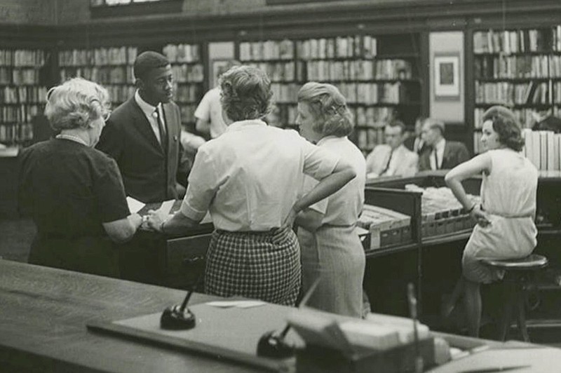 Miles College student Shelly Millender, standing in suit, is shown during an effort to desegregate the public library in Birmingham, Ala., on April 10, 1963. (Birmingham News/Alabama Department of Archives and History via AP)


