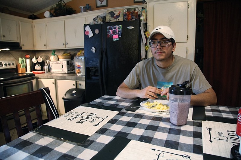 Samuel Alfaro, pauses between responses during an interview at his home in Houston, Texas, Friday, July 23, 2021. Alfaro said his appointment to help obtain deferred action for childhood arrival or DACA immigration status was canceled due to a recent federal court ruling against the program. (AP Photo/John L. Mone)


