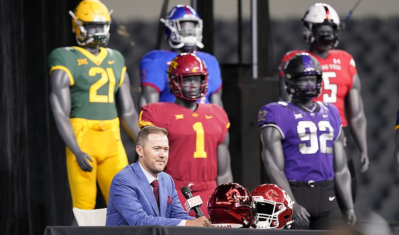 Oklahoma head football coach Lincoln Riley speaks from the stage with mannequins in the back ground during NCAA college football Big 12 media days Wednesday, July 14, 2021, in Arlington, Texas. (AP Photo/LM Otero)