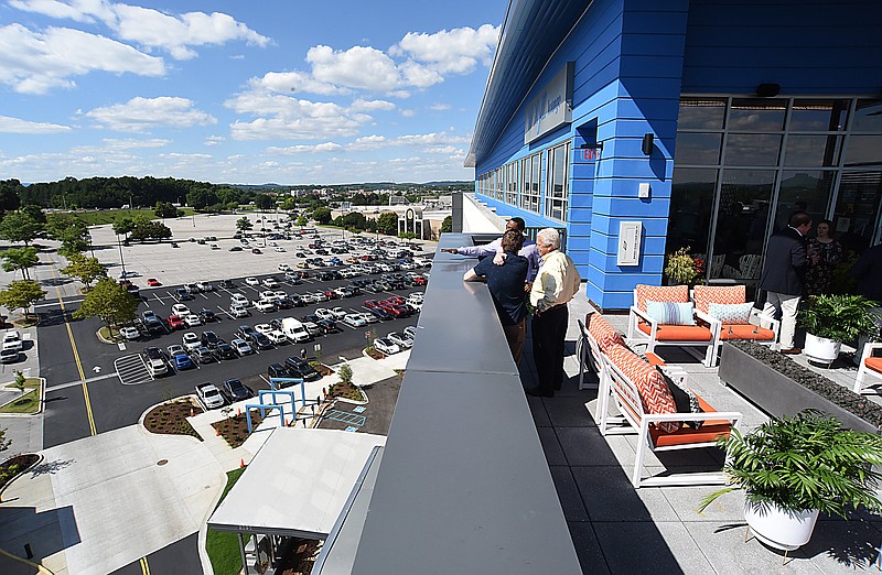 Staff Photo by Matt Hamilton / Guests enjoy the rooftop bar at the new Aloft Hotel in Chattanooga in June. With certain restrictions, guests with two-night stays at Tennesse hotels are eligible for the flight voucher, and some 230 packages have been booked in Chattanooga.