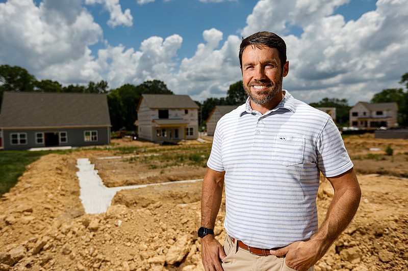 Staff photo by Troy Stolt / RP Homes owner Gabe Thomas at the company's new housing development, Baldwin Park, in Hixson. After the price of building materials increased dramatically, Thomas delayed the sale of lots in the second phase of the development.