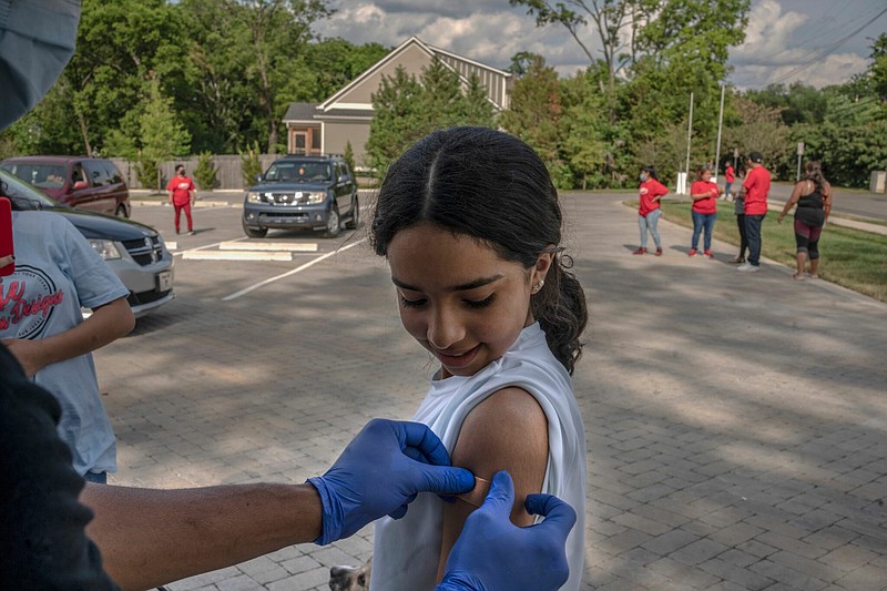 Maya Gana, 13, was pleased to become vaccinated during a pop-up clinic at Our Lady of Guadalupe Church in Nashville. (Photo: John Partipilo)