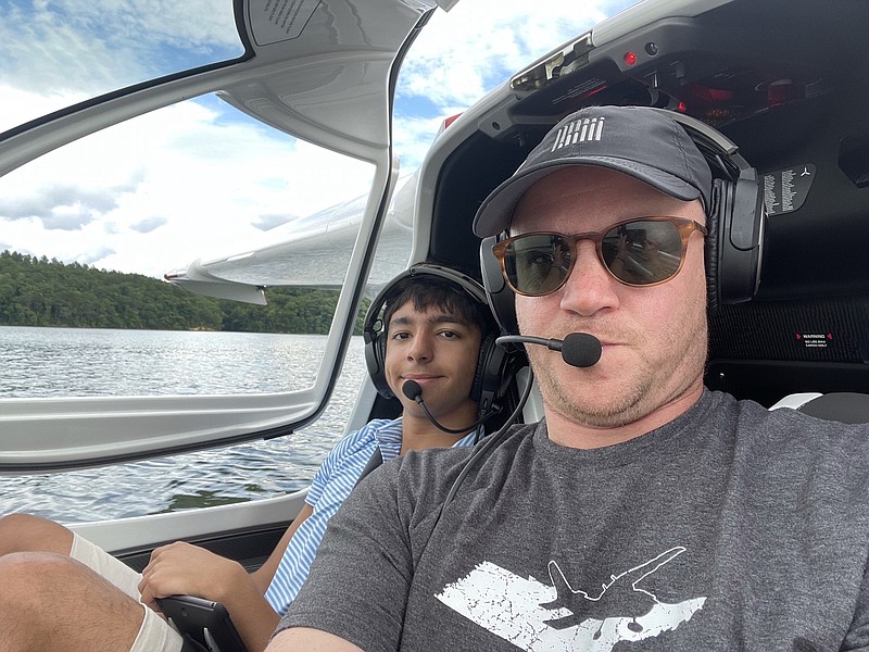 Contributed photo / Chattanooga businessman Craig Fuller is shown with son Max in an ICON 5 amphibious aircraft on the Tennessee River.