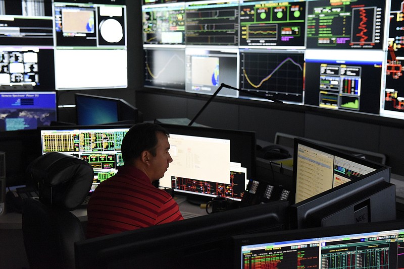 Staff Photo by John Rawlston / TVA workers control and monitor the system's electric grid at the TVA power operations center Thursday, Aug. 27, 2015, in Chattanooga, Tenn.