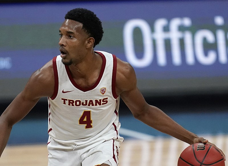 FILE - In this March 11, 2021, file photo, Southern California's Evan Mobley plays against Utah in an NCAA college basketball game in the quarterfinal round of the Pac-12 men's tournament in Las Vegas. Mobley is the headliner among big men in this year's NBA draft. (AP Photo/John Locher, File)