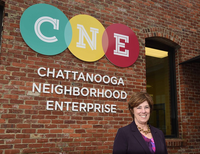 Martina Guilfoil, executive director of Chattanooga Neighborhood Enterprise, stands in front of the building in 2014.