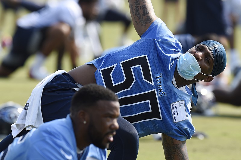 AP photo by Mark Zaleski / Tennessee Titans linebacker Derick Roberson (50) stretches during the team's first training camp practice on Wednesday in Nashville.