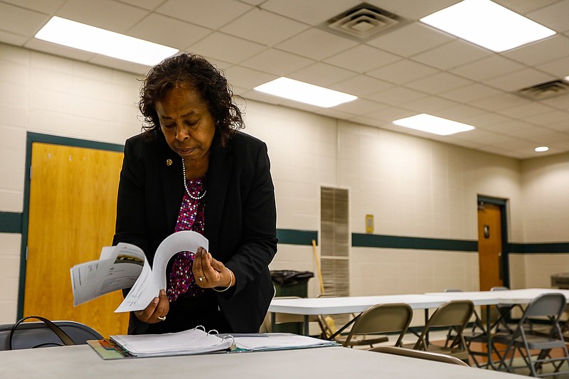 Staff photo by Troy Stolt / Mary Lambert, the new director of community health for the city of Chattanooga, looks through paperwork while setting up a free COVID vaccine clinic at Eastdale Community Center on July 14, 2021.