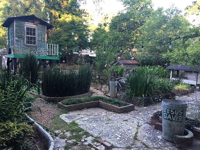 This corner of the four-acre Paradise Garden grounds created by folk artist Howard Finster features the shimmering Mirror House, top left. / Photo by Bill Rankin/Atlanta Journal-Constitution