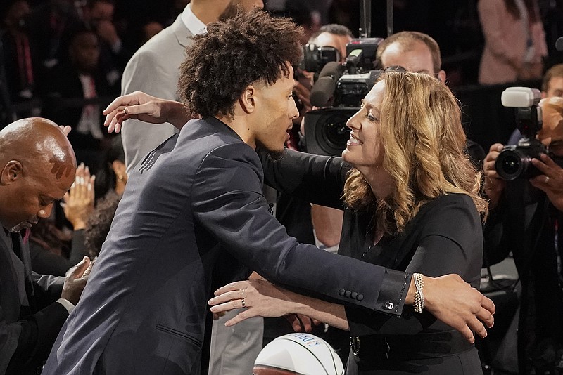 AP photo by Corey Sipkin / Cade Cunningham, left, hugs family and friends after being selected as the No. 1 overall pick by the Detroit Pistons during the NBA draft Thursday night in New York.