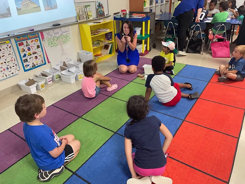 A Tennessee teacher works with students at a summer learning camp at Rutland Elementary School in Mt. Juliet, east of Nashville, on June 30, 2021. / Marta W. Aldrich / Chalkbeat