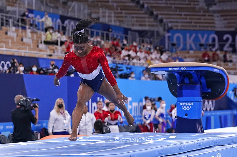 Simone Biles, of the United States, lands from the vault during the artistic gymnastics women's final at the 2020 Summer Olympics, Tuesday, July 27, 2021, in Tokyo. (AP Photo/Gregory Bull)