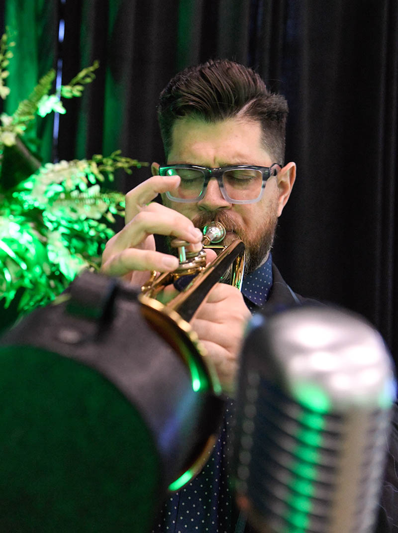 Photo by Mark Gilliland / Nathan Warner entertains guests.
