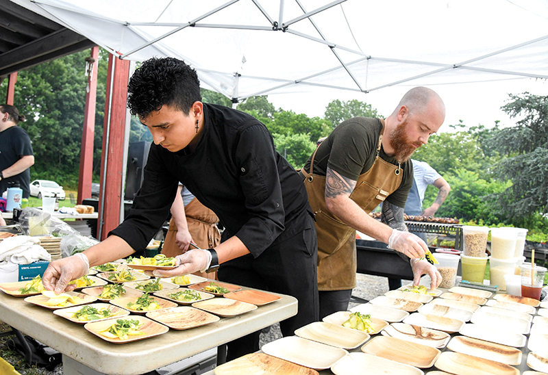 Photo by Mark Gilliland / Carlos Castro, left, and Sanders Parker prepare the squash carpaccio.
