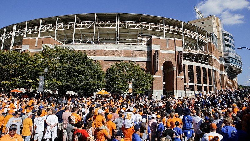 Staff photo / Tennessee and BYU football fans watch the Vol Walk outside Knoxville's Neyland Stadium before a game in September 2019.