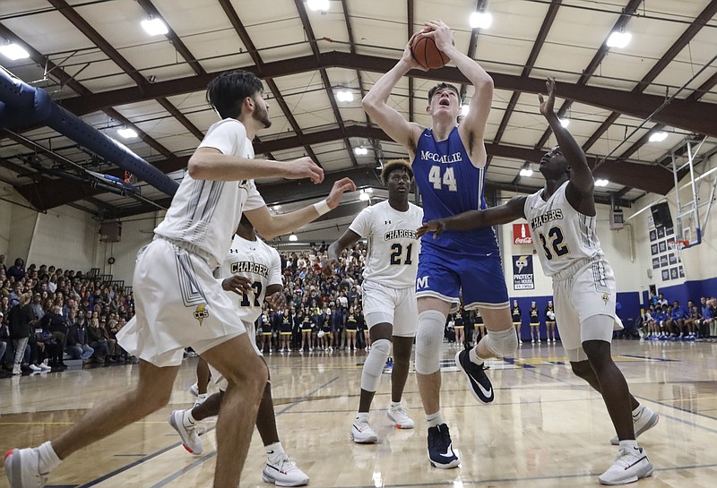 Staff photo by Troy Stolt / McCallie's David Craig (44) drives to the basket during a game at Chattanooga Christian in February 2020.