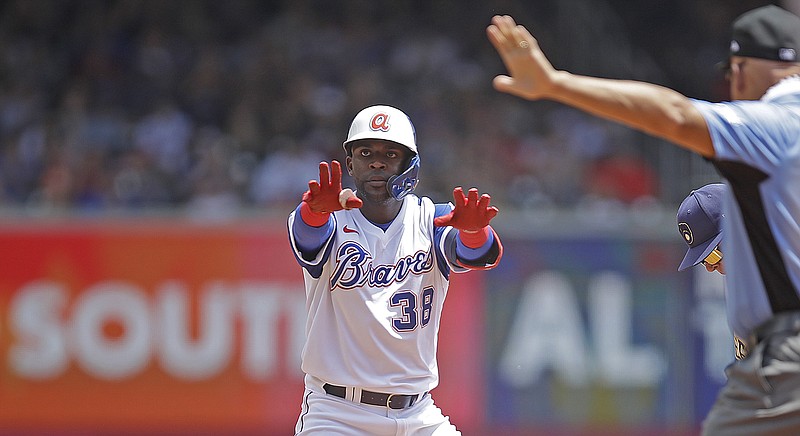 AP photo by Ben Margot / Atlanta Braves center fielder Guillermo Heredia celebrates after hitting a leadoff double off Milwaukee Brewers pitcher Brett Anderson in the third inning of Sunday's game in Atlanta. Heredia moved to third on a ground ball but was left stranded, and the Braves lost 2-1 as another bid to push their record back to .500 failed.