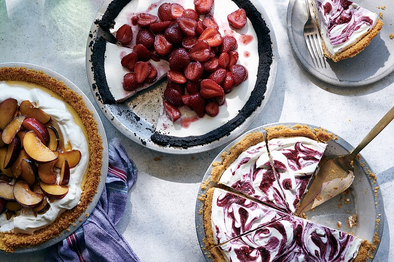 From left, milk and honey pie with cereal crust, strawberry cream pie with chocolate cookie crust, and blackberry frozen yogurt pie with cracker crust. The perfect pies for lazy days combine buttery press-in crumb shells with no-bake fillings and piles of fresh fruit. / Photo by David Malosh/The New York Times