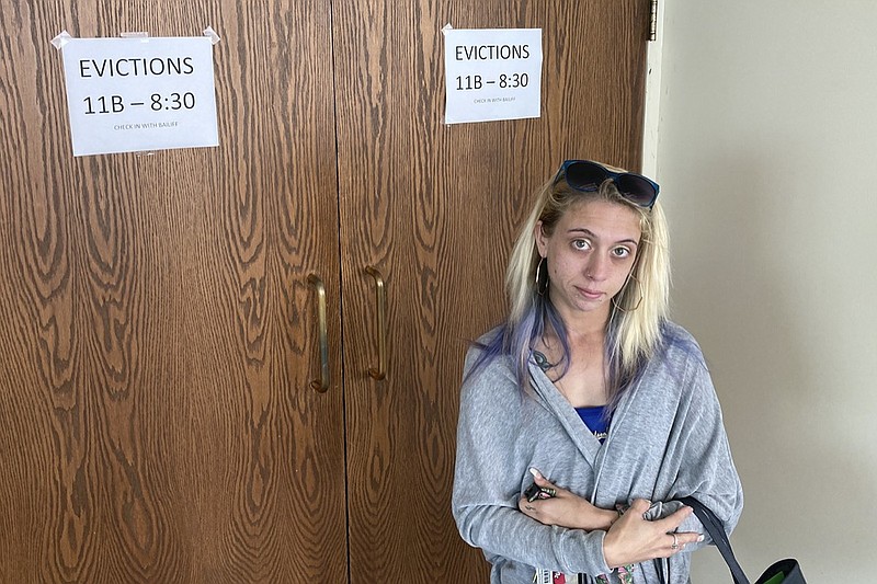 Chelsea Rivera, 27, stands outside Franklin County evictions court in Columbus, Ohio on Monday, August 2, 2021 as she awaits a hearing on an eviction notice filed against her last month. The single mom is behind $2,988 in rent and late fees for the one bed-room apartment she rented for herself and her three young sons. "We just need help," Rivera pleaded. Housing advocates fear the end of the Centers for Disease Control and Prevention moratorium on evictions on Saturday July 31, could eventually result in millions of people being evicted. (AP Photo/Andrew Welsh-Huggins)