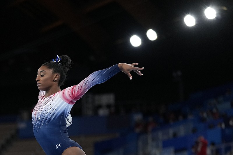 Simone Biles, of the United States, performs on the balance beam during the artistic gymnastics women's apparatus final at the 2020 Summer Olympics, Tuesday, Aug. 3, 2021, in Tokyo, Japan. (AP Photo/Ashley Landis)