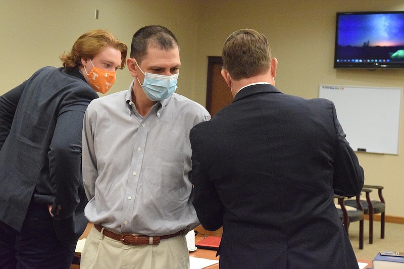 Staff photo by Ben Benton / Robert Joe Whittenburg, center, talks to his attorney, Sam Hudson, right, and intern Jacob Lewis, left, during his trial in Winchester, Tenn., on two counts of first-degree murder in the slayings of Deanna Lawrence and her daughter, Dedra Lawrence in November 2017.