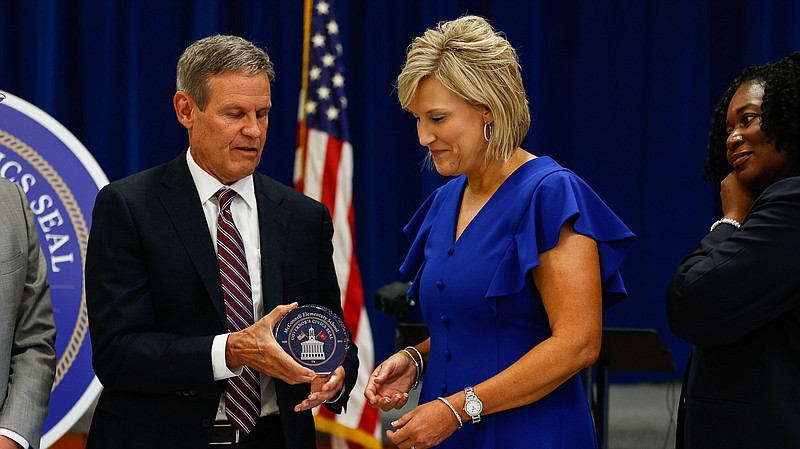 Governor Bill Lee presents Principal Ruth Pohlman with the Governor's Civic Seal, an award given to schools and districts that prioritize teaching the nations history and core values, according to the Governor Lee's office at McConnell Elementary School on Wednesday, August 11, 2021. McConnell Elementary is one of 53 schools in the state to receive this recognition from the Governor.