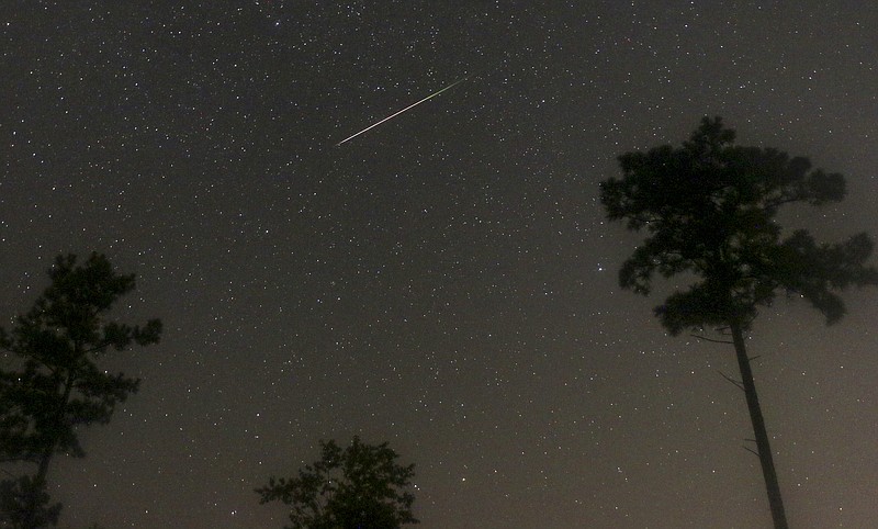 Arkansas Democrat-Gazette File Photo/Stephen B. Thornton / Space debris from the tail of the Swift-Tuttle comet strikes the atmosphere in this photograph taken five miles west of Benton, Ark., shortly after 3 a.m. on Aug. 12, 2016.
