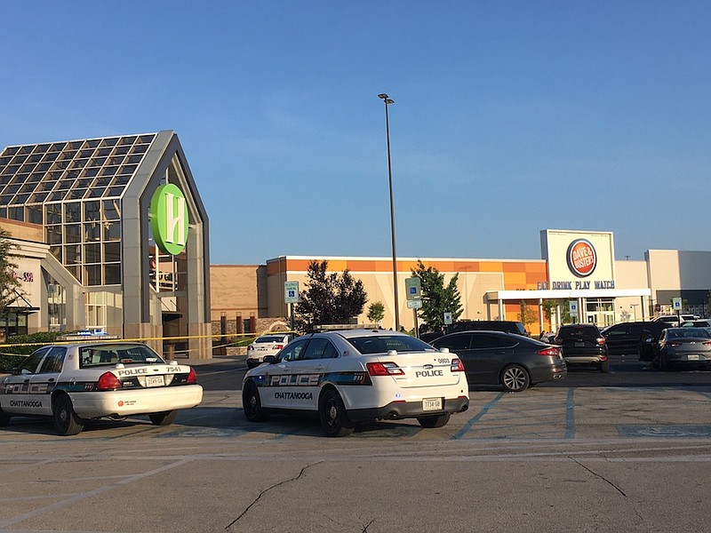 Staff photos by Mary Fortune / Police cruisers were parked at Hamilton Place Mall on Thursday as officers worked the crime scene.