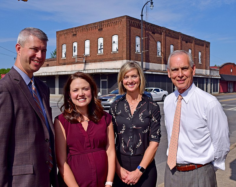 Staff Photo by Robin Rudd / From left, Adam Osborne, Partner, Chattanooga Office (will be the Managing Partner of the Cleveland Office when complete), Amy Donahue, vice president of marketing for HHM, Beverly Edge, COO, General Counsel and Partner, Chattanooga Office, and Donnie Hutcherson, Managing Partner, Chattanooga Office, are pictured in front of the future Cleveland office. HHM, Henderson Hutcherson & McCullough CPAs, is expanding into Cleveland with a office to be established in a planned renovation on East Inman Street.