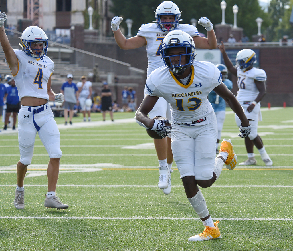 Staff Photo by Matt Hamilton / Teammates cheer as Boyd Buchanan (13) Jayden Madison scores a touchdown Friday. Eight local football teams squared off in eight different 20-minute games Friday, August 13, 2021 at Finley Stadium.