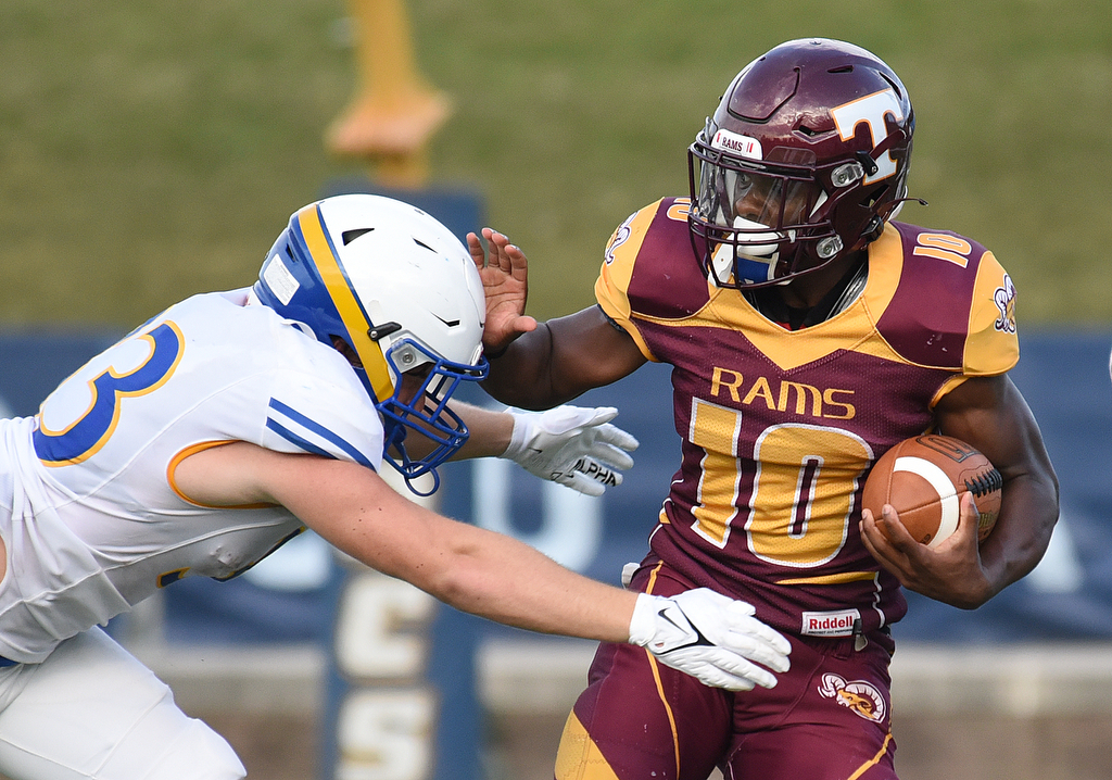 Staff Photo by Matt Hamilton / Boyd Buchanan (33) Matt Stone hits Tyner (10) Ben Blackburn Friday. Eight local football teams squared off in eight different 20-minute games Friday, August 13, 2021 at Finley Stadium.