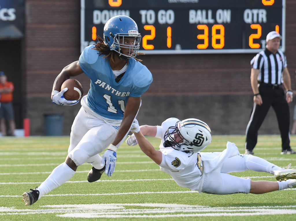 Staff Photo by Matt Hamilton / Brainerd (11) Talijah Witt breaks a tackle by Soddy Daisy (2) Drew Lewis on Friday. Eight local football teams squared off in eight different 20-minute games Friday, August 13, 2021 at Finley Stadium.
