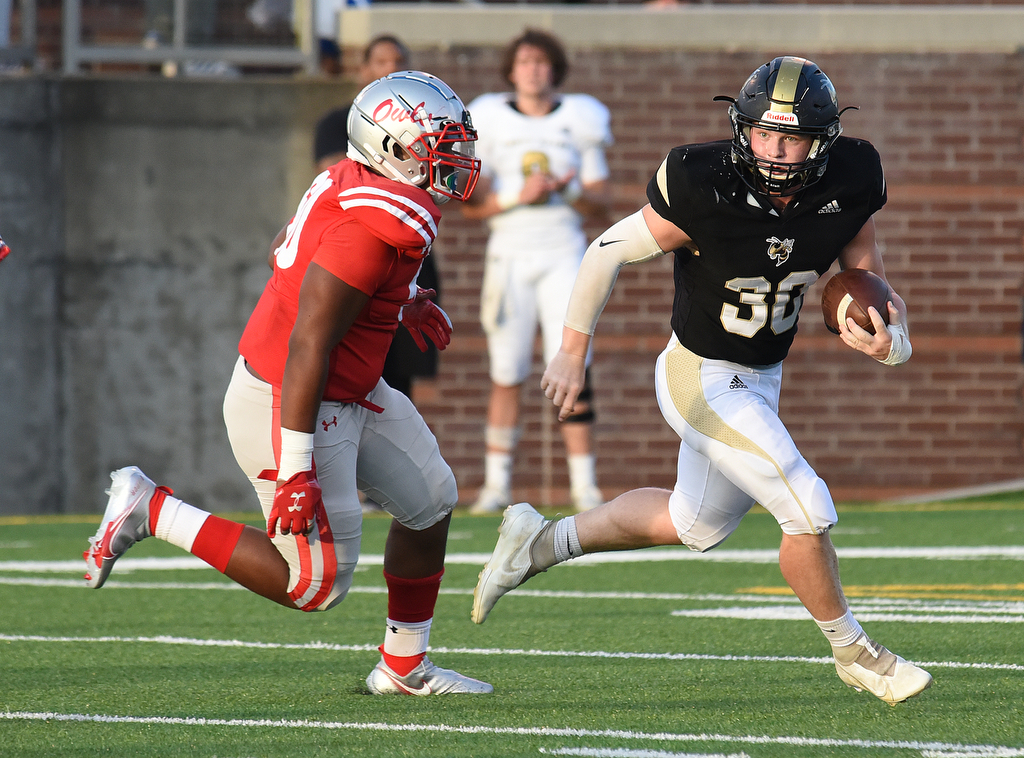 Staff Photo by Matt Hamilton / Lookout Valley (30) Jaxon Quails carries the ball Friday against Ooltewah. Eight local football teams squared off in eight different 20-minute games Friday, August 13, 2021 at Finley Stadium.