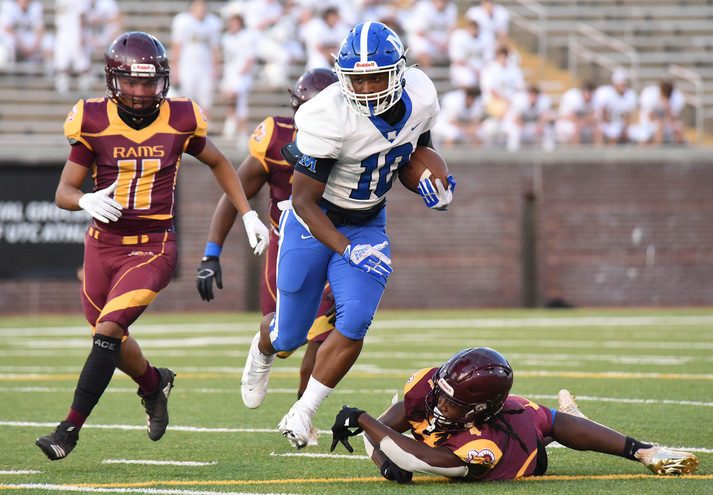 Staff Photo by Matt Hamilton / McCallie (10) Ontario Price carries the ball Friday against Tyner. Eight local football teams squared off in eight different 20-minute games Friday, August 13, 2021 at Finley Stadium.