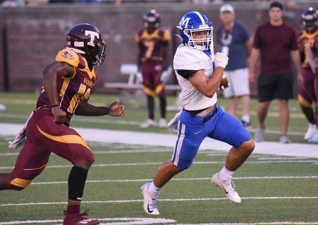 Staff Photo by Matt Hamilton / McCallie (4) Weston Hammond carries the ball against Tyner Friday. Eight local football teams squared off in eight different 20-minute games Friday, August 13, 2021 at Finley Stadium.